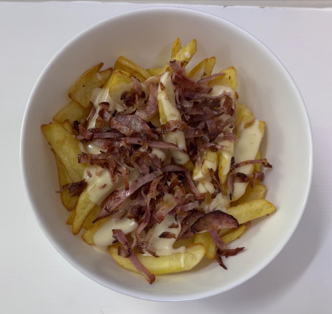 Patate Scavate con fonduta di formaggio e bacon